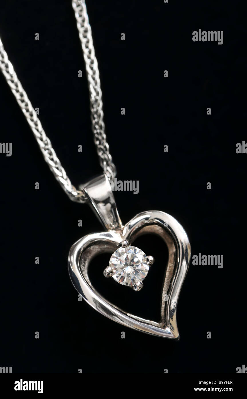White gold heart pendant with diamond on a chain Stock Photo
