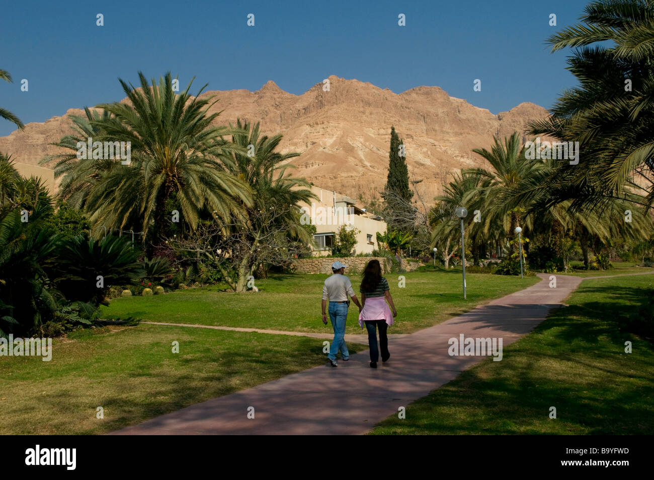 People walking in Kibbutz Ein Gedi near Dead Sea Israel Stock Photo