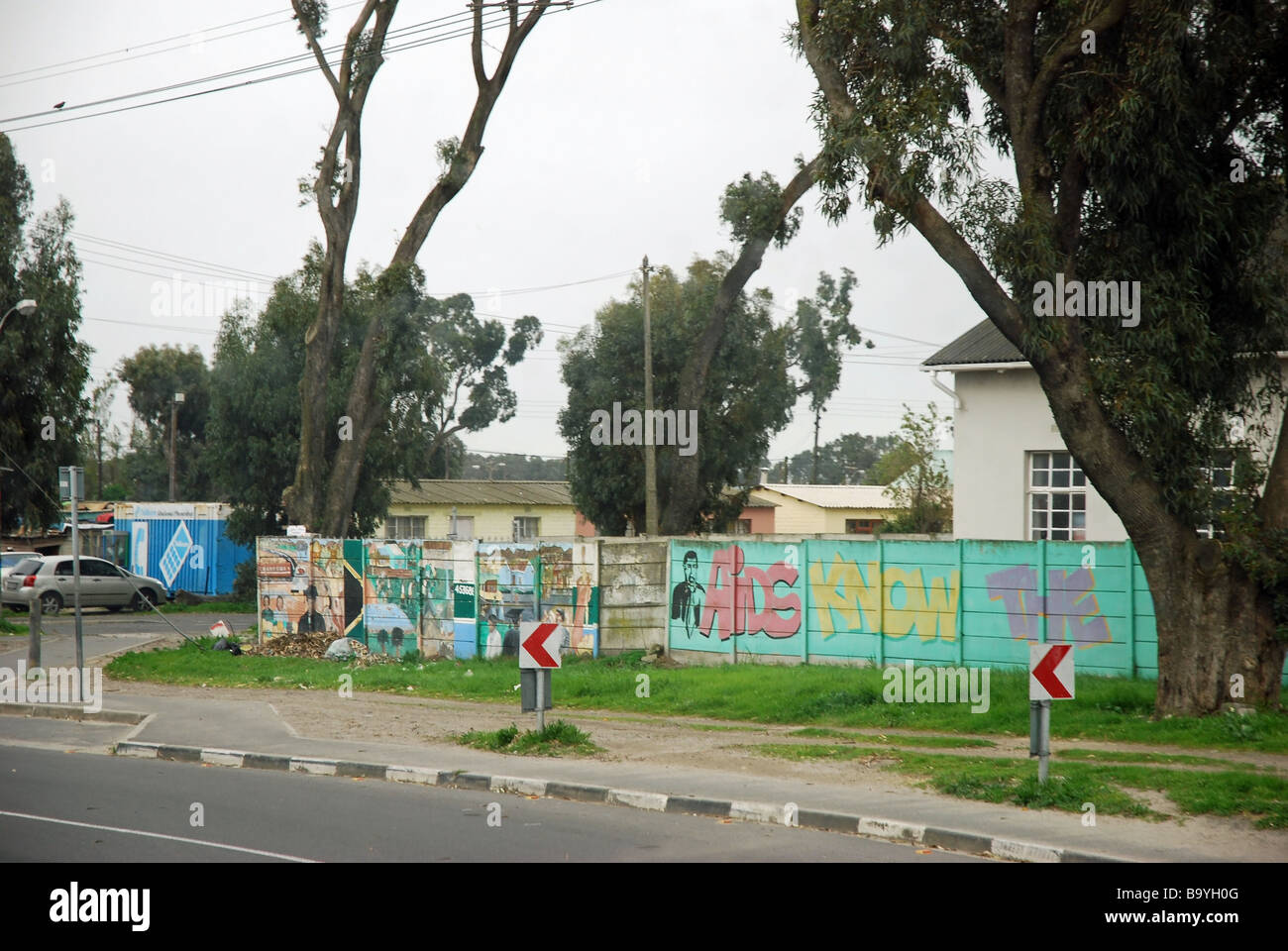 Wall painting warning of AIDS alongside a road entering Langa Township, Cape Town, South Africa Stock Photo