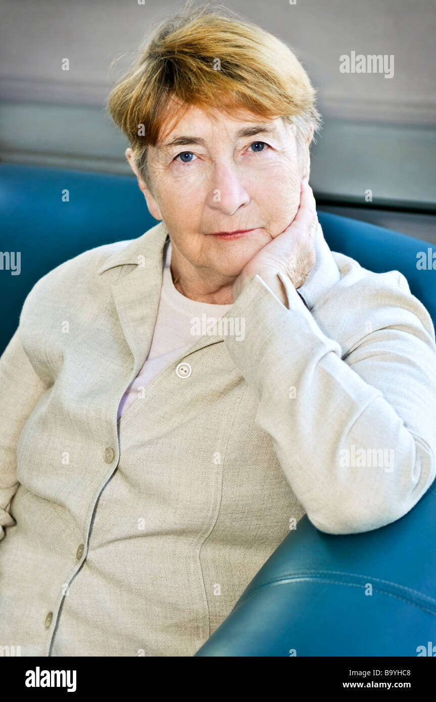 Old lady sitting in a chair hi-res stock photography and images - Alamy