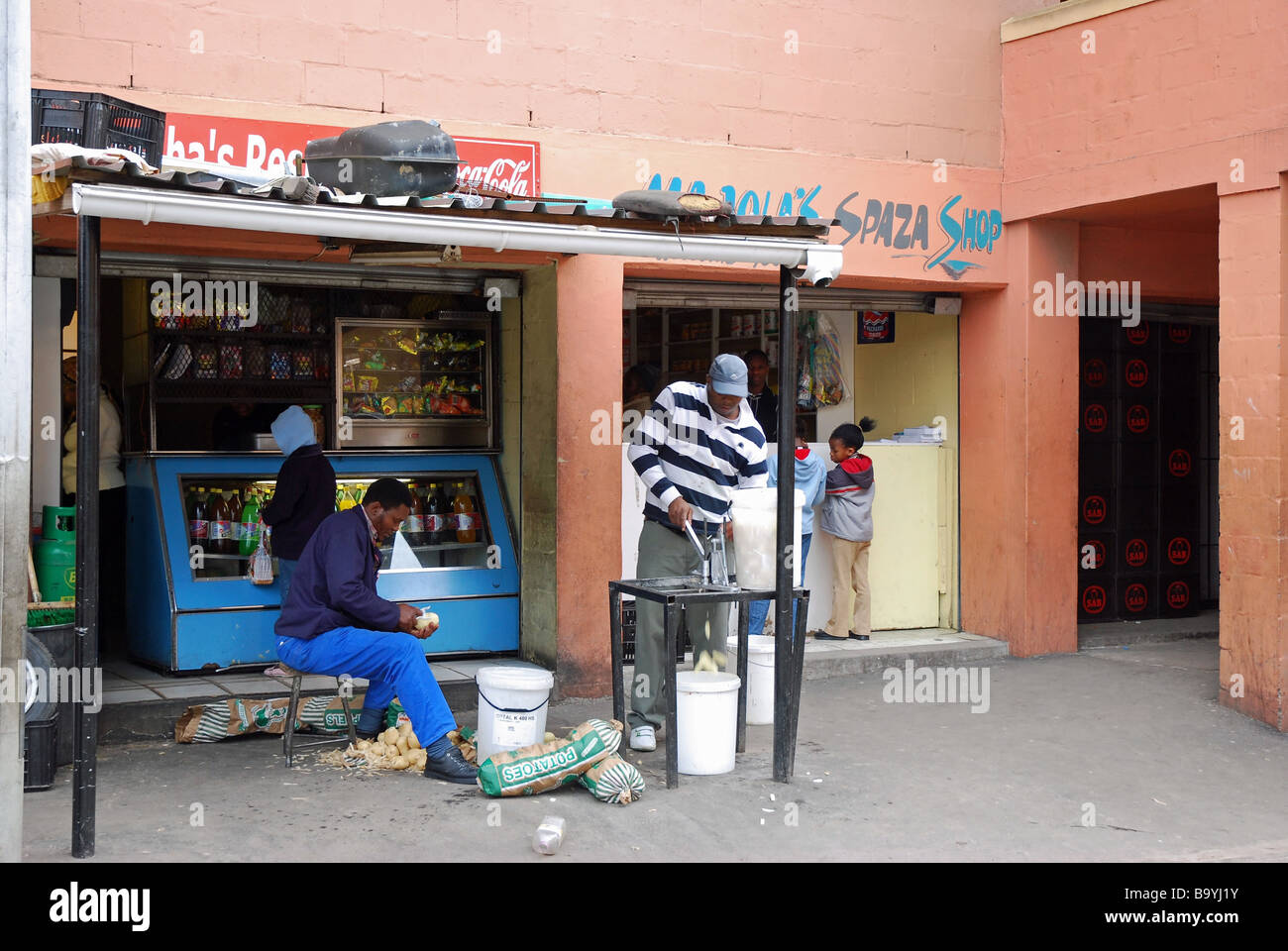 Spaza and soft drinks store next door to each other in the ground floor of a maisonette, Langa Township, Cape Town, South Africa Stock Photo