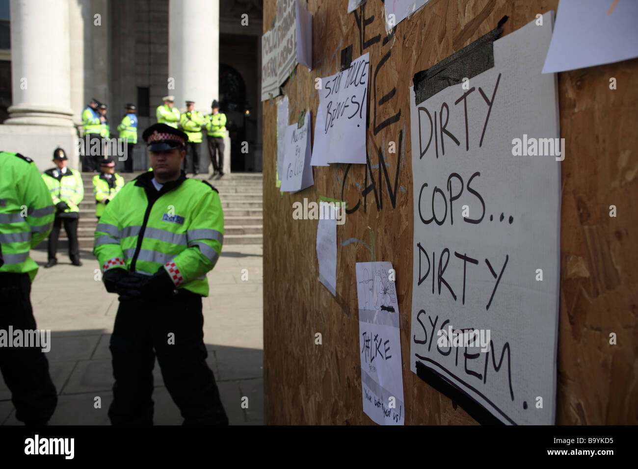 Anti-police protest messages posted on a board outside the Bank of England during the 2009 G20 summit, London, UK. Stock Photo