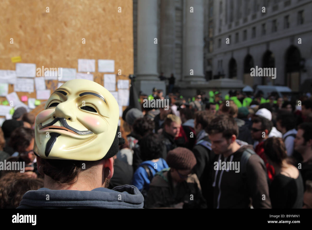 Masked protester outside the Bank of England during the 2009 G20 summit, London, UK. Stock Photo