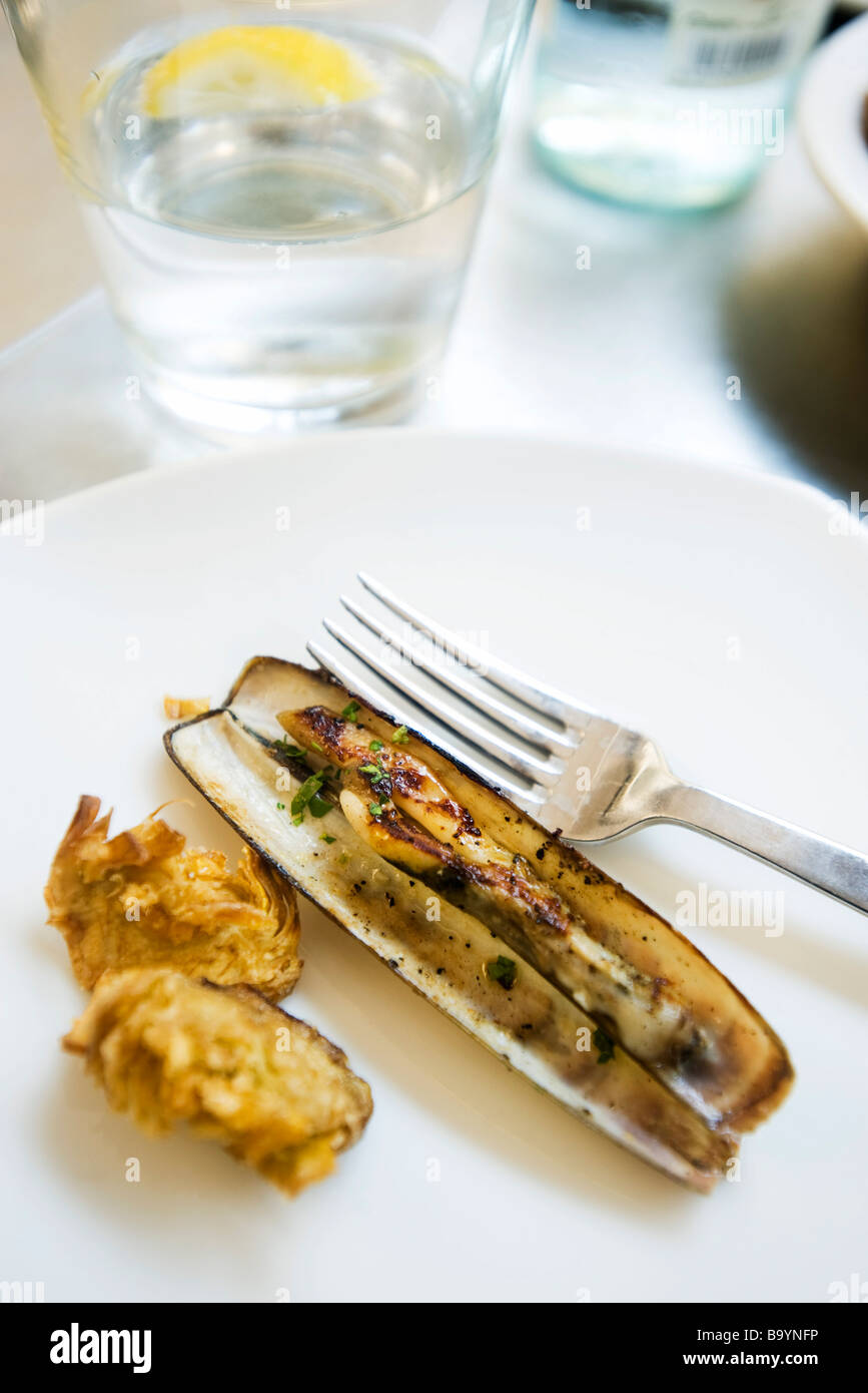 Steamed razor clam with fried artichoke heart Stock Photo Alamy