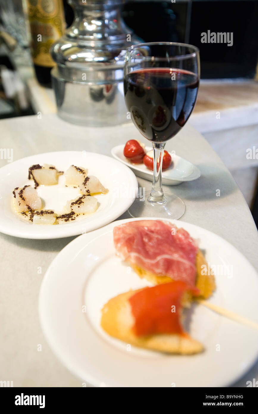 Appetizers and glass of red wine Stock Photo Alamy