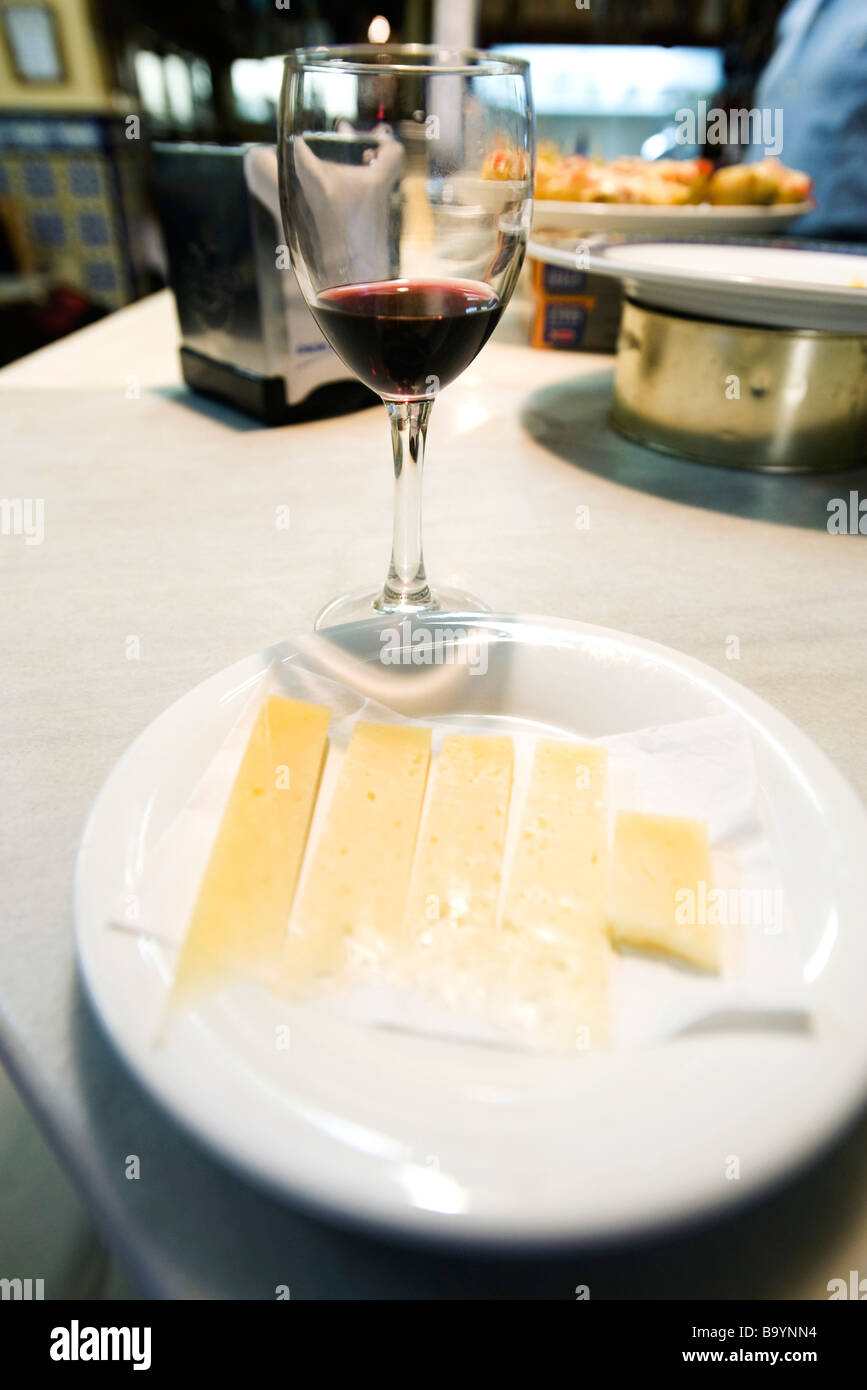 Manchego cheese with glass of red wine Stock Photo Alamy