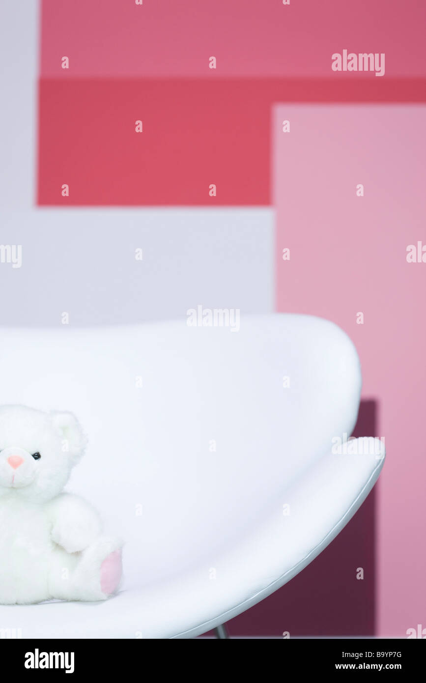 Teddy bear sitting on armchair Stock Photo - Alamy