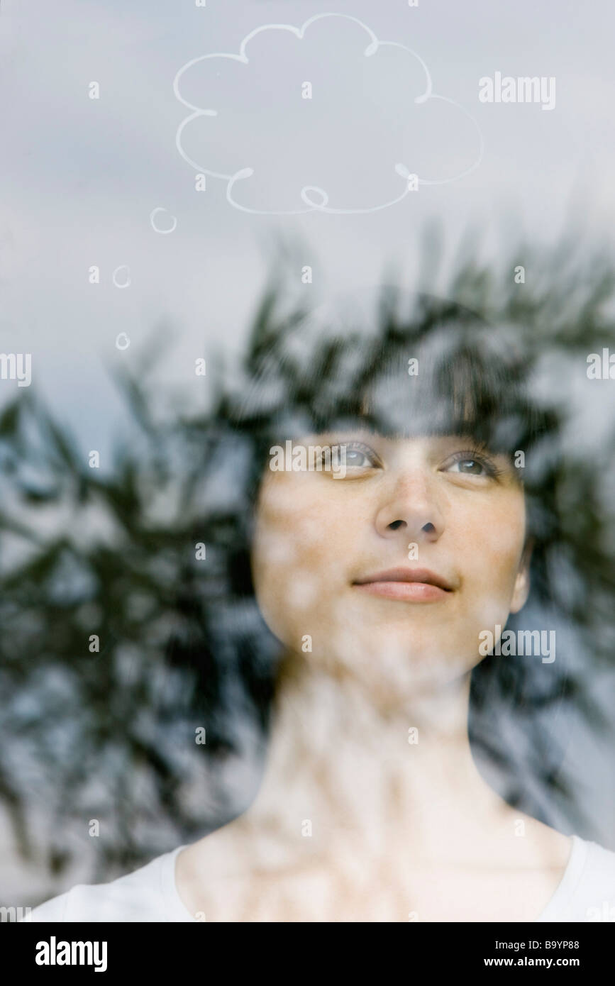 Young woman with thought bubble over head Stock Photo