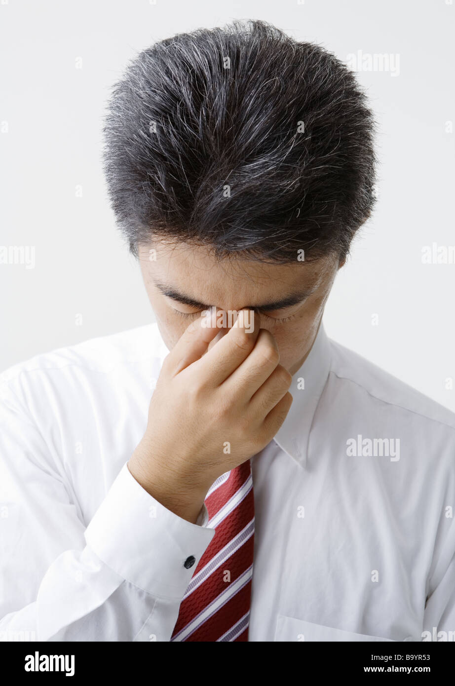 A man dabbing his eyes Stock Photo