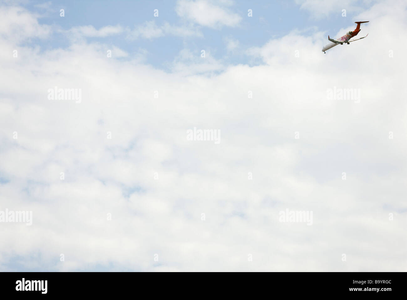 Commercial airplane in sky Stock Photo