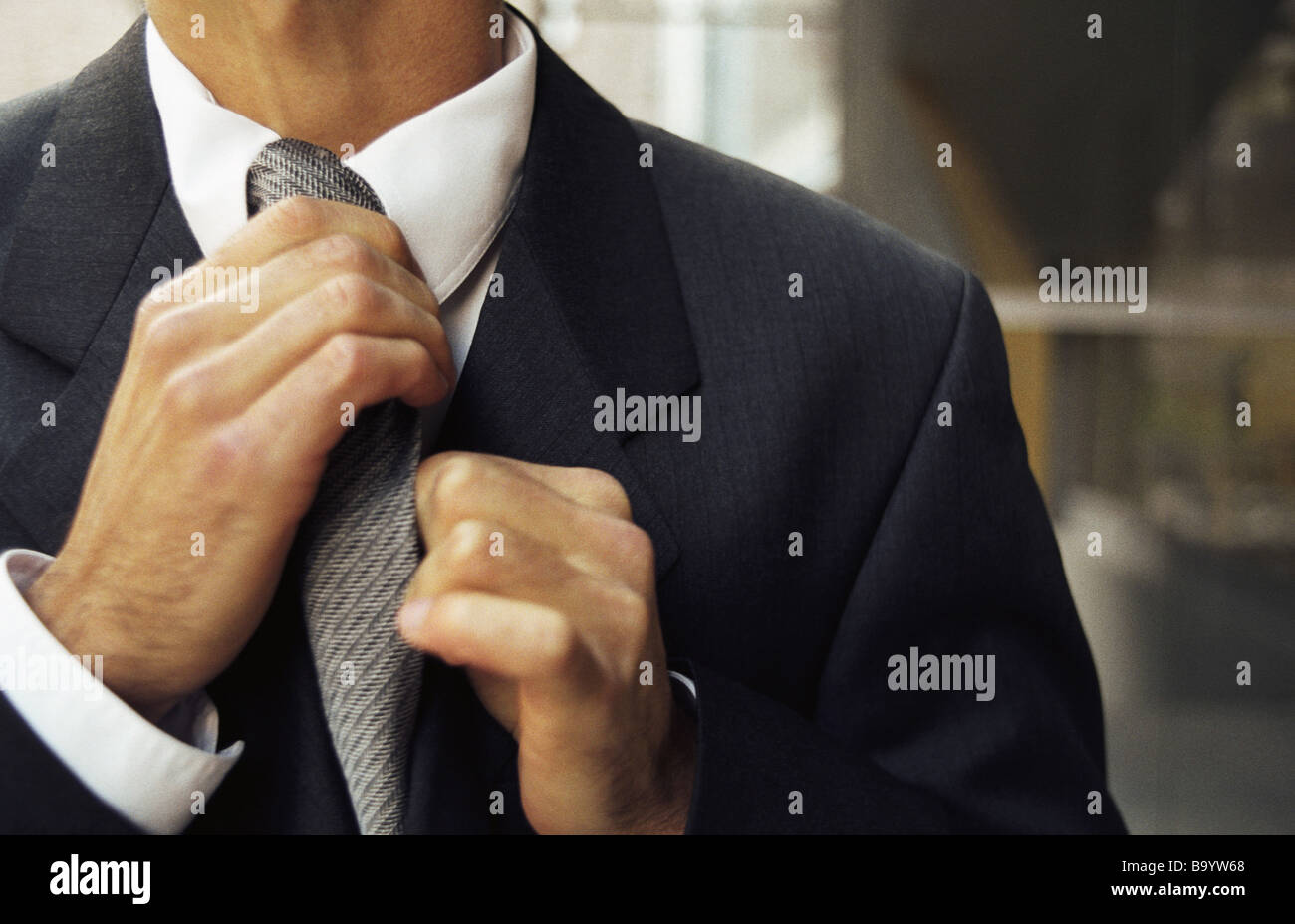 Man adjust tie hi-res stock photography and images - Alamy