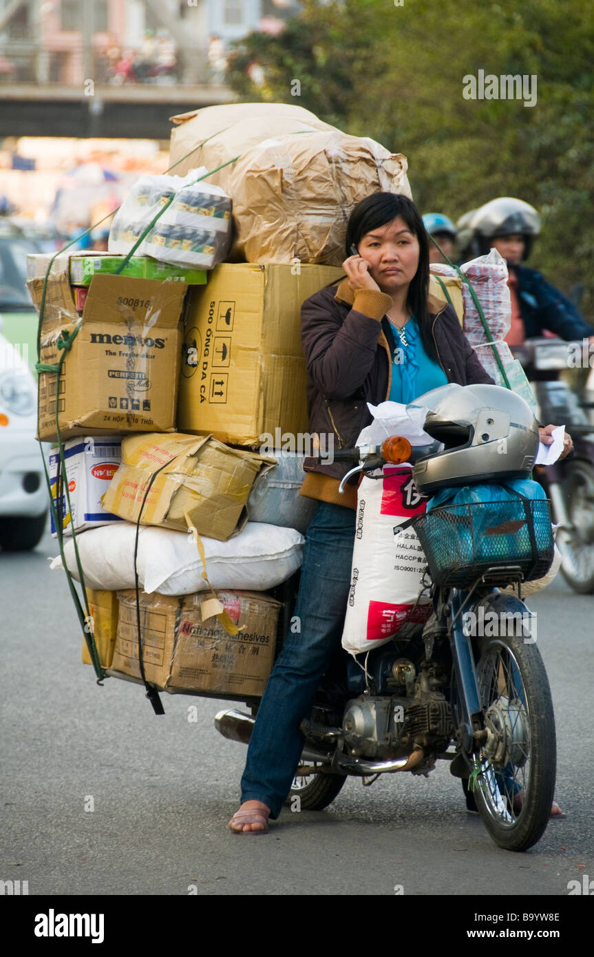 overloaded-motorcycle-in-hanoi-vietnam-B9YW8E.jpg