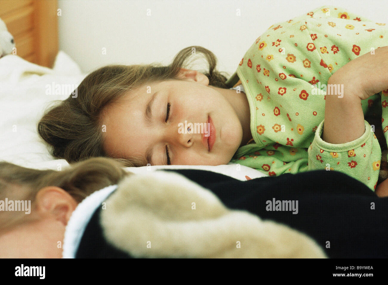 Girls sleeping in pajamas Stock Photo Alamy
