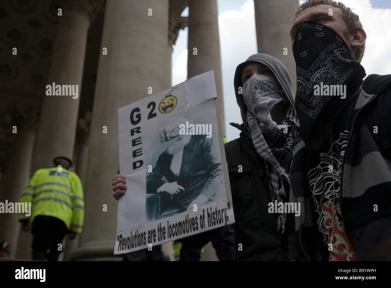 Anti-capitalist youths in masks protest against G20 summit in London, April 1 2009 Stock Photo