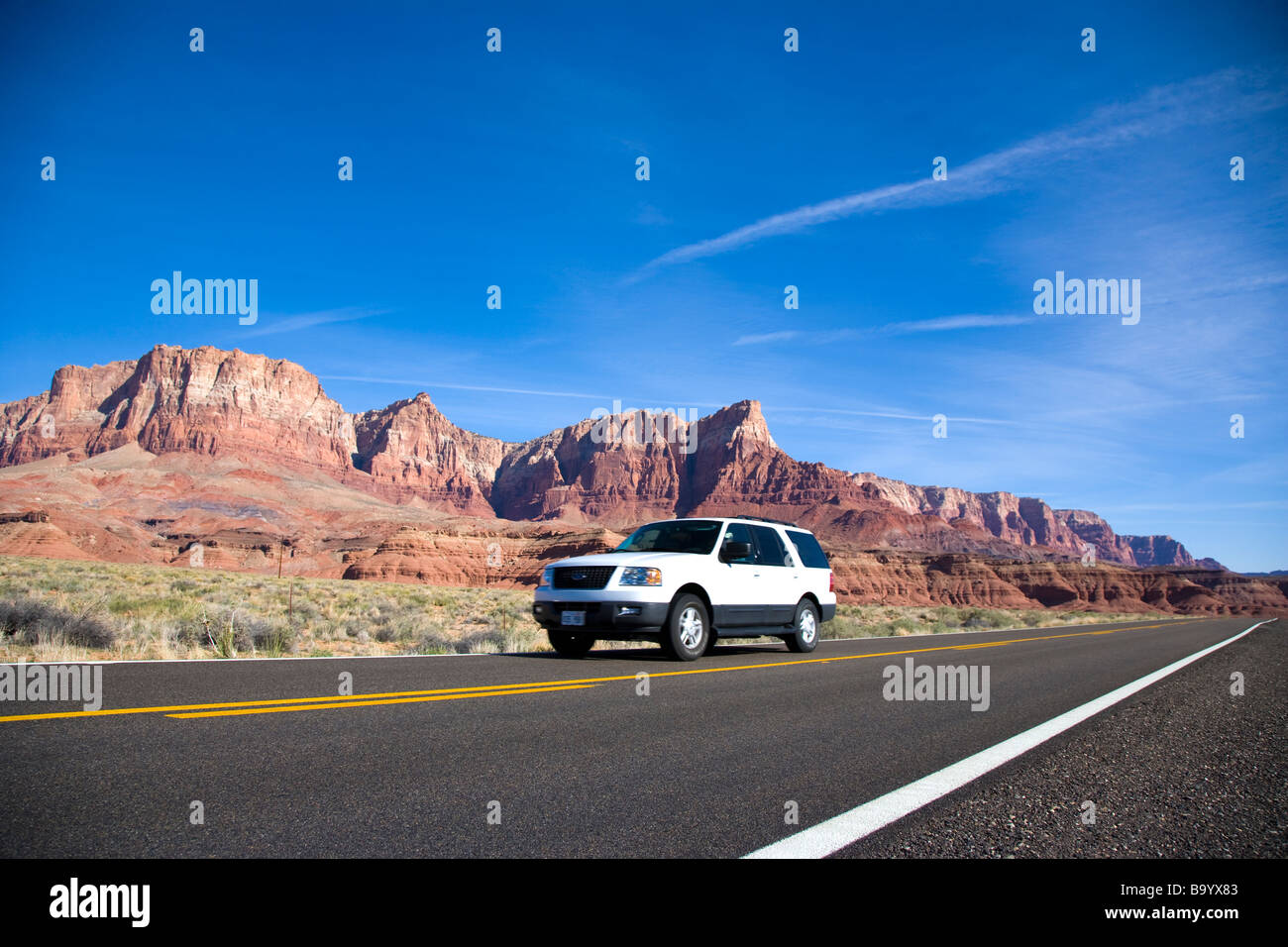 Vehicle travelling through landscape at Vermillion Cliffs near Lee s Ferry Arizona USA Stock Photo