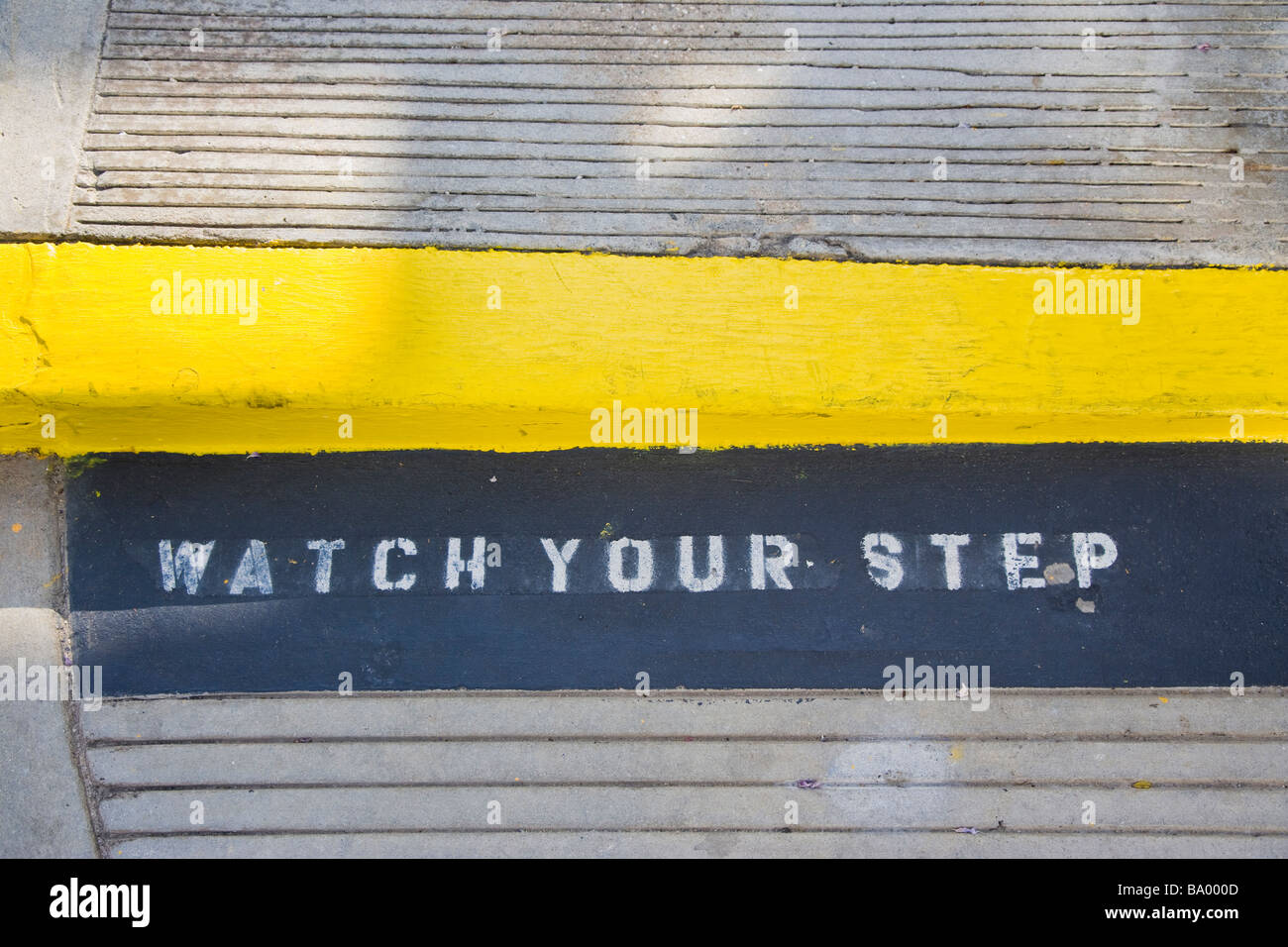 Watch your step sign painted onto sidewalk Santa Monica Los Angeles California USA Stock Photo