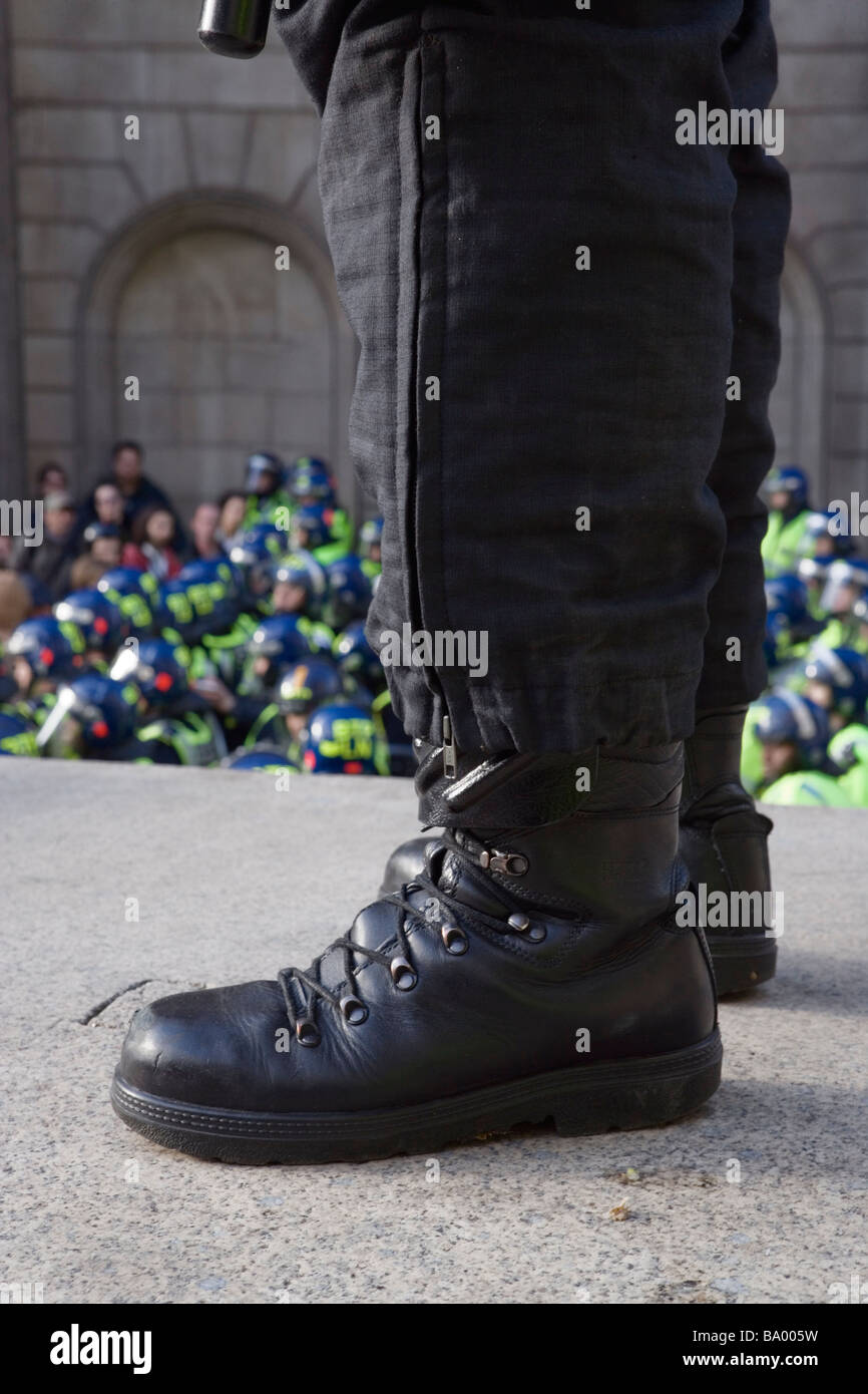 Police officer stands guard during anti-capitalist protest against G20 summit in London, April 1 2009 Stock Photo