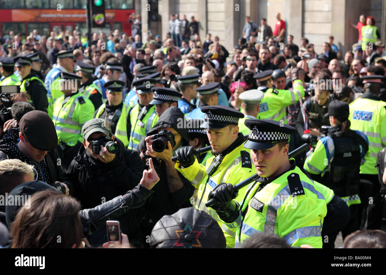 Protesters and police clash outside the Bank of England during the 2009 G20 summit, London, UK. Stock Photo