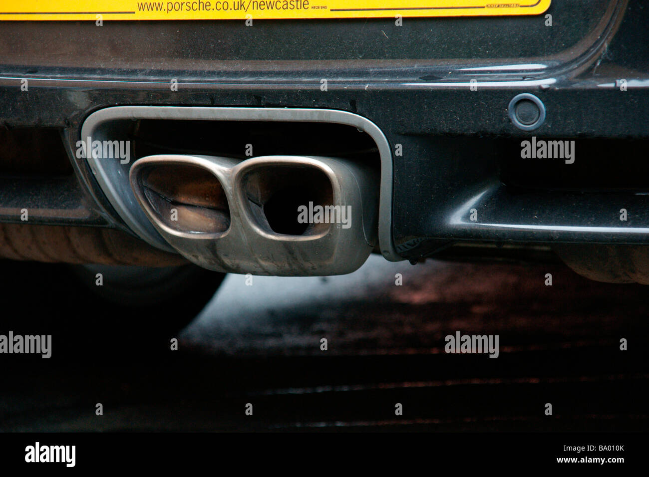 The exhaust pipe on a Porsche sports car Leeds West Yorkshire England