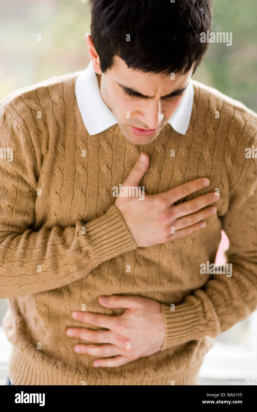 Man with indigestion Stock Photo