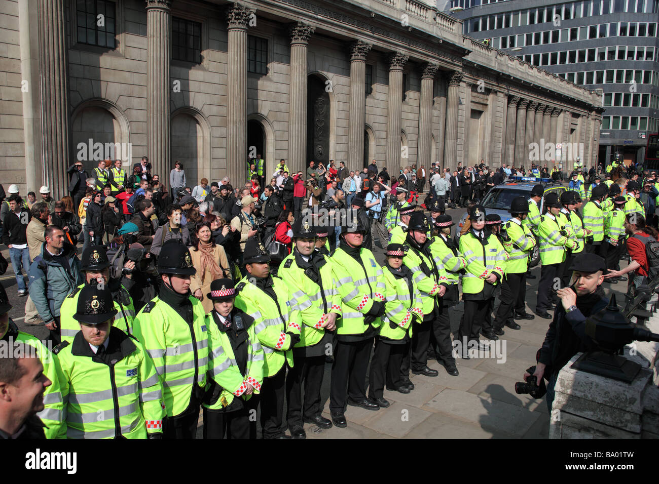 Protesters face police cordon outside the Bank of England during the 2009 G20 summit, London, UK. Stock Photo