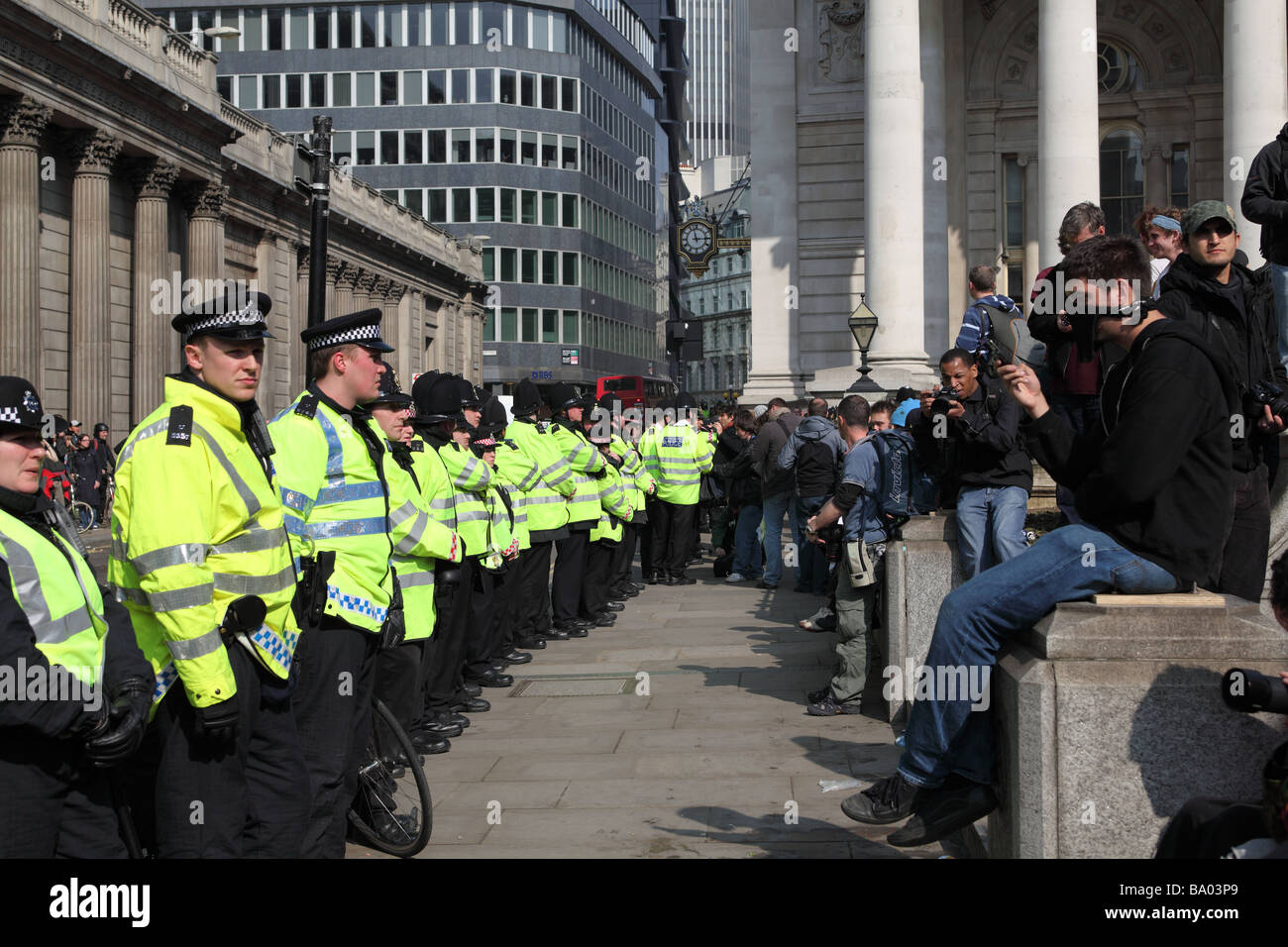 Protesters face police cordon outside the Bank of England during the 2009 G20 summit, London, UK. Stock Photo