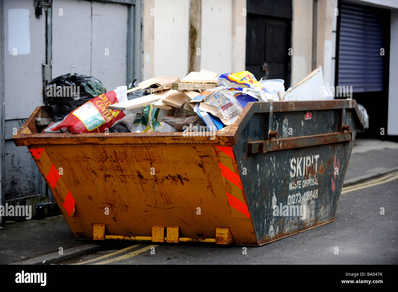 A skip full of building waste Stock Photo