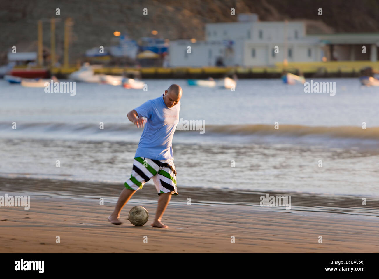 Playing football on the beach at San Juan del Sur, Nicaragua. Stock Photo