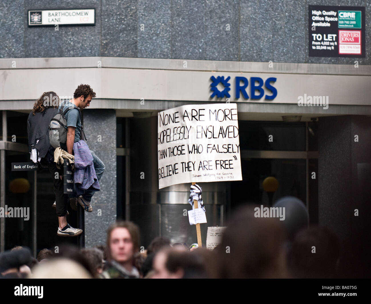 Protesters outside the Royal Bank of Scotland at the G20 demonstration in the City of London. Stock Photo