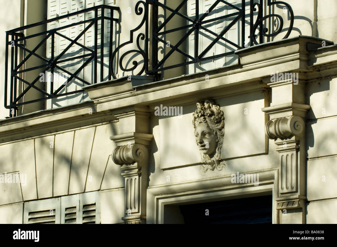 Railing, architectural detail of a woman and facade on the Ile Saint ...