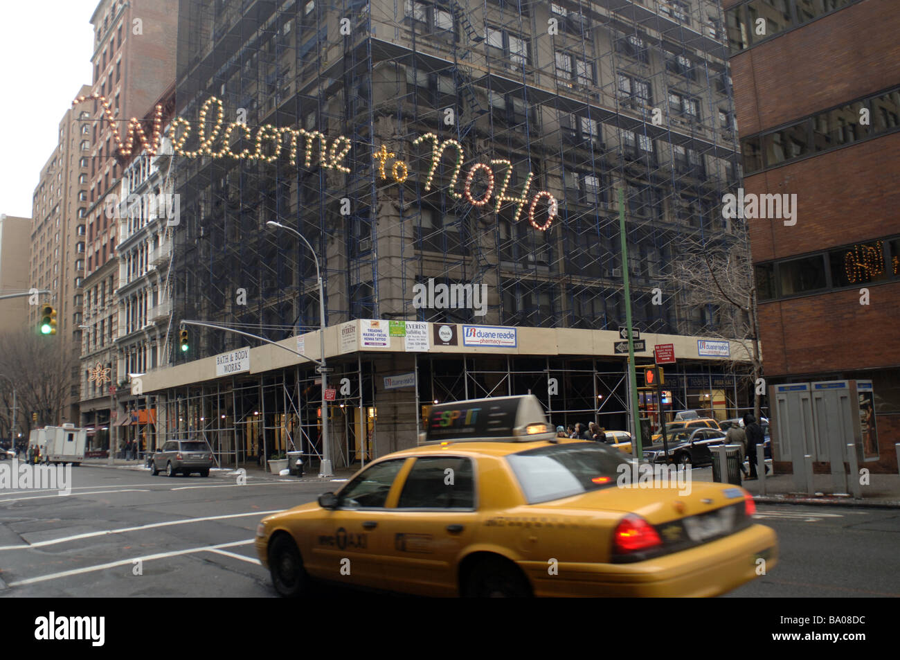 An illuminated sign on Broadway in New York welcomes shoppers to the neighborhood of Noho Stock Photo