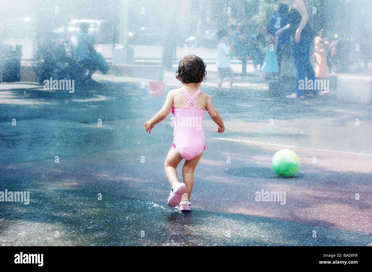 little girl in pink bathing suit