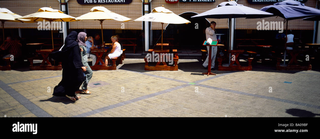 Port Louis Mauritius Muslim Walking By Keg And Marlin  A Pub And Restaurant Stock Photo