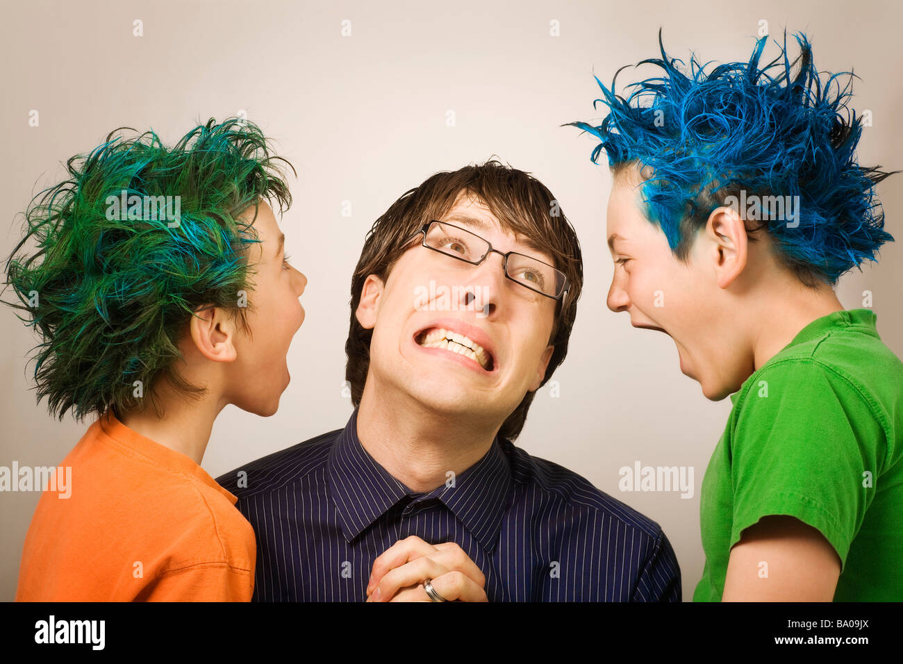 Man pleading with two yelling kids Stock Photo - Alamy