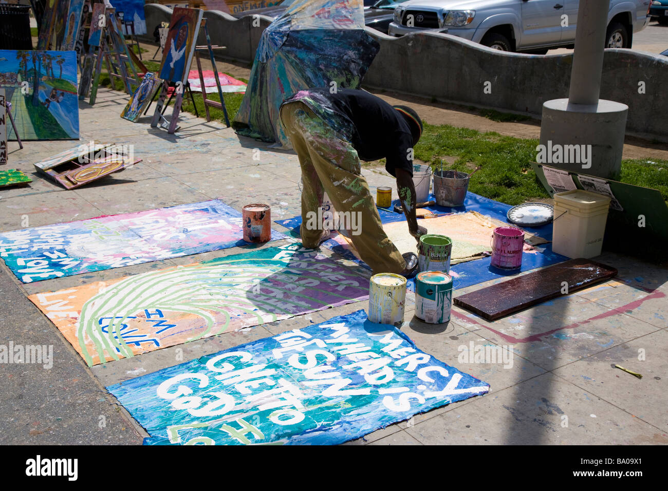 Man painting art signs Venice Los Angeles California USA Stock Photo