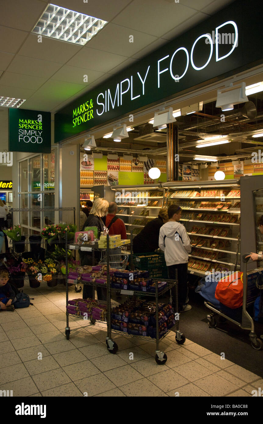 Shoppers at Marks and Spencer food shop Luton Airport Luton England UK Europe Stock Photo