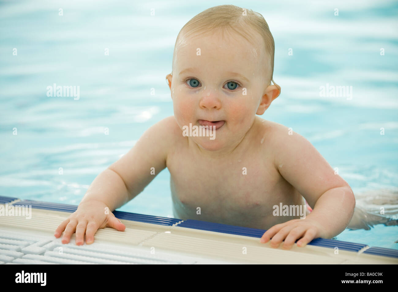 BABY SWIMMING LESSONS 15 MONTH OLD TODDLER GIRL ENJOYS LEARNING IN A