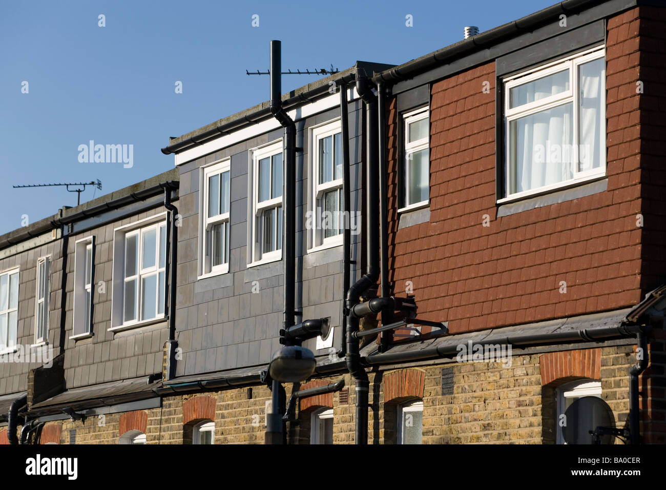 Dormer roof extension additions / dormers / dormas / dorma roofs extensions on terrace house / terraced houses in Twickenham. UK Stock Photo