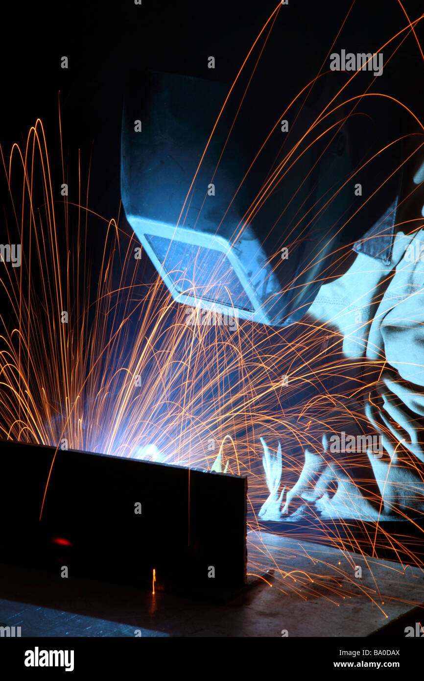 Welder working in manufacturing plan Stock Photo