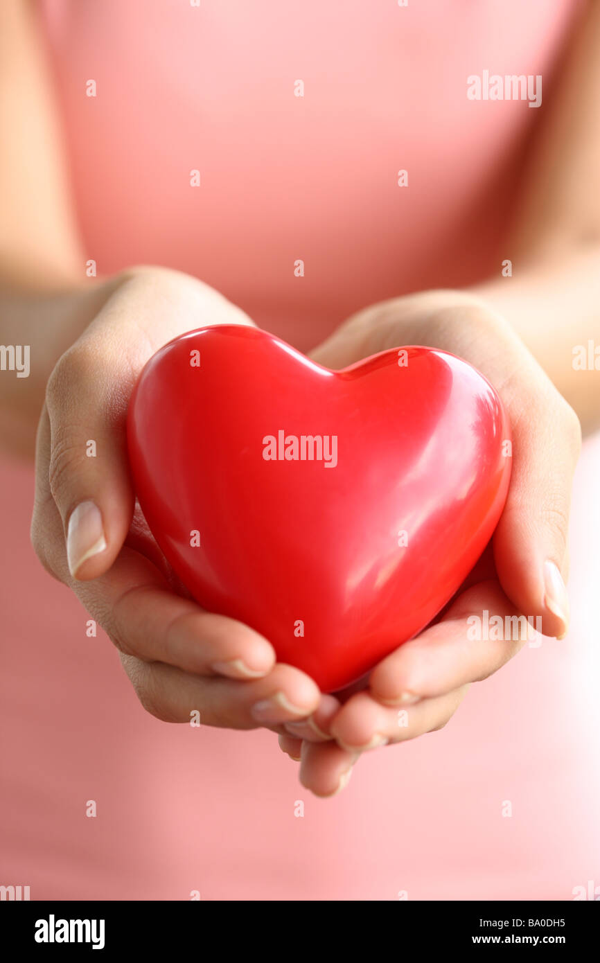 Hands holding red heart Stock Photo