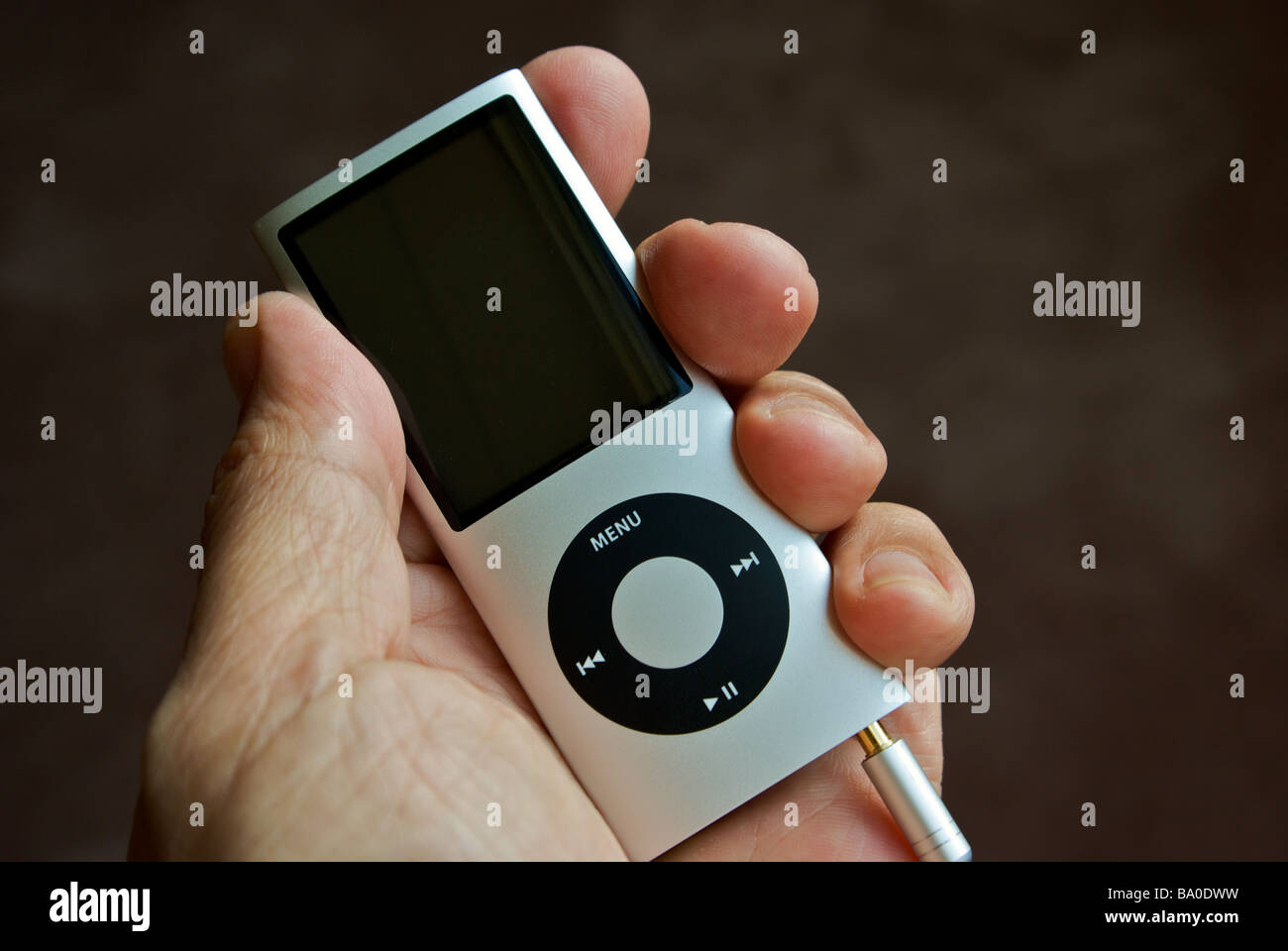 Hand holding Apple iPod Nano MP3 personal portable stereo player Stock Photo
