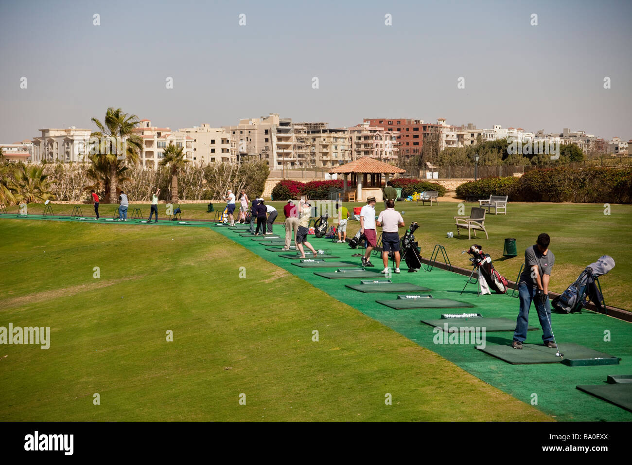 golfers on driving range, Katameya Heights golf course, New Cairo, Egypt Stock Photo