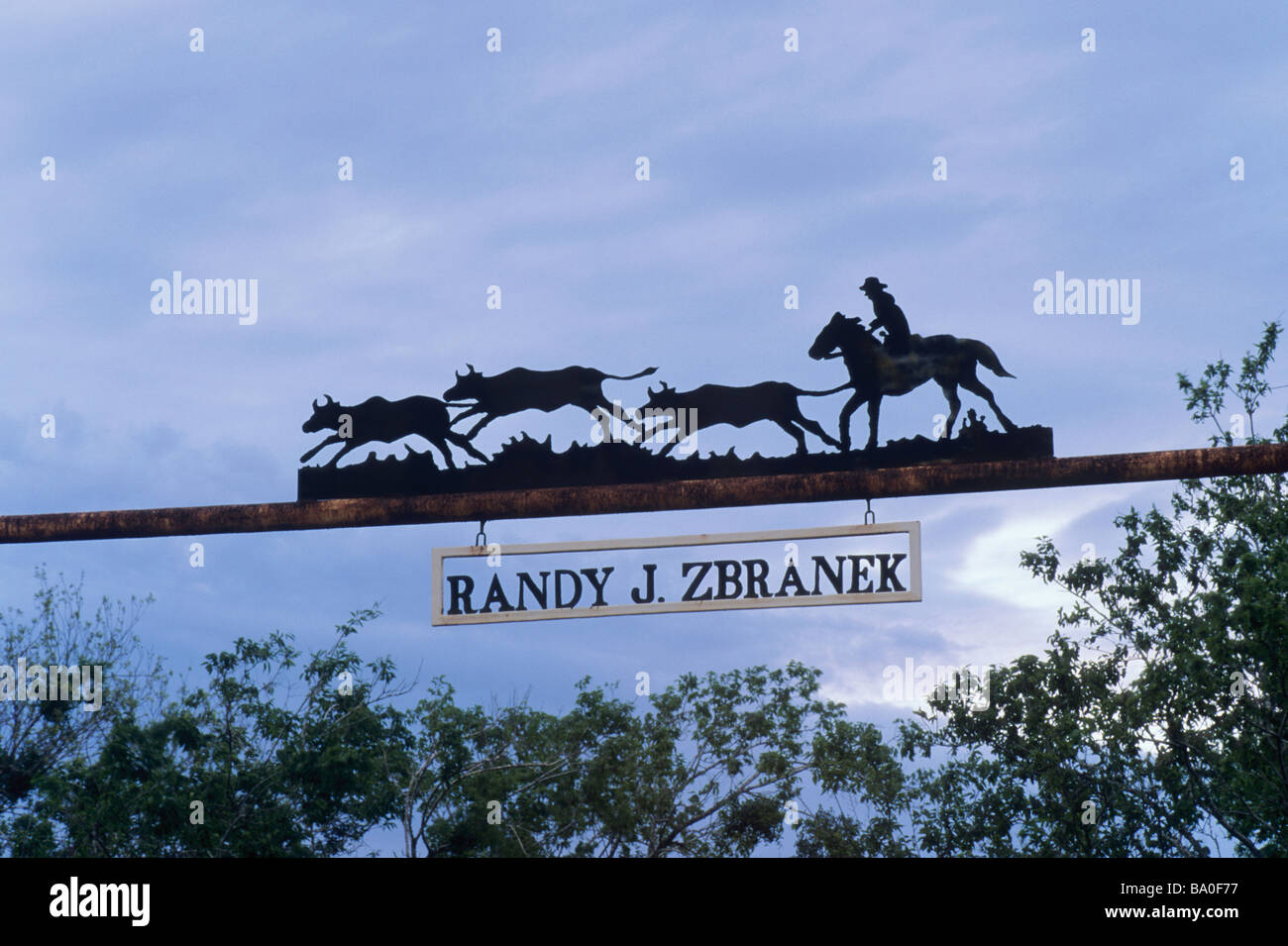 Wrought iron sign at ranch gate at FM 487 highway near Bartlett at ...