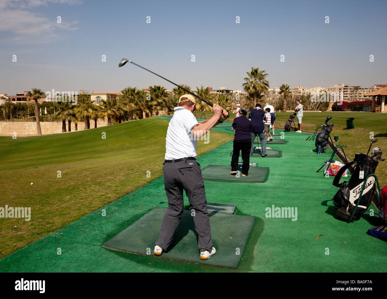 golfers on driving range, Katameya Heights golf course, New Cairo, Egypt Stock Photo