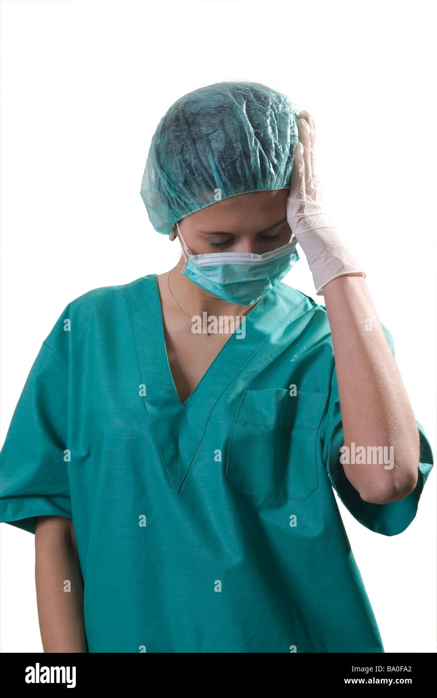 Tired nurse head in hand Stock Photo