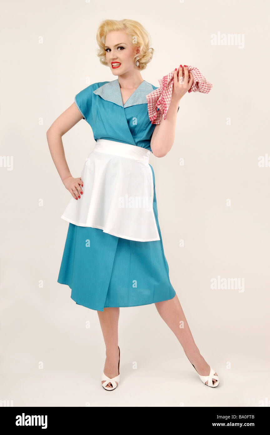 1950s style woman holding a dish cloth Stock Photo