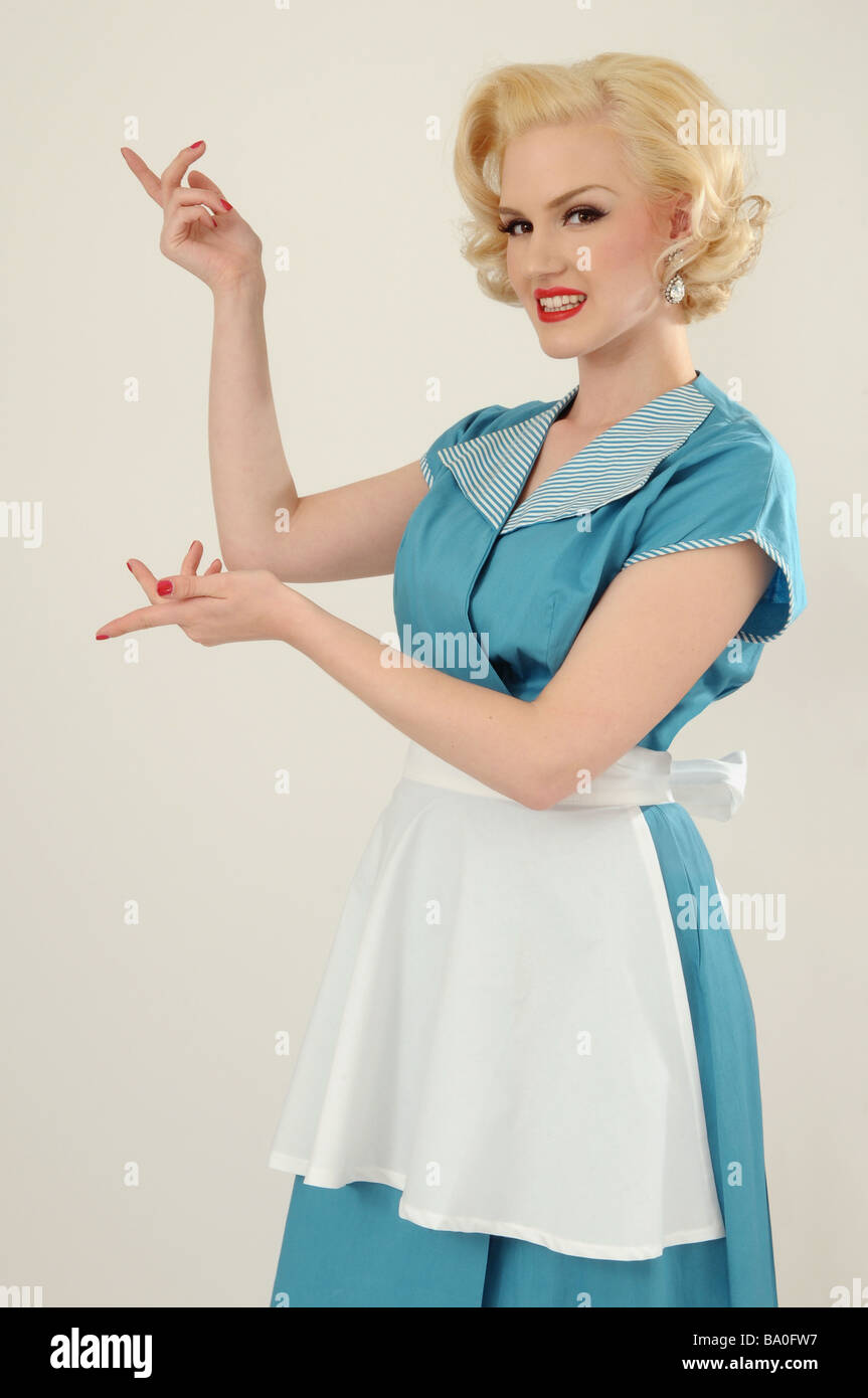 1950s housewife or waitress pointing Stock Photo