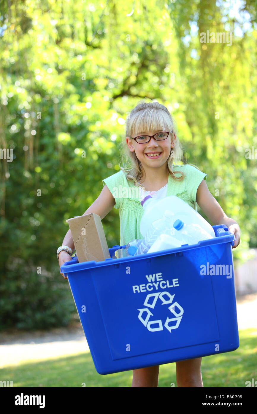 Young girl with recycle bin Stock Photo
