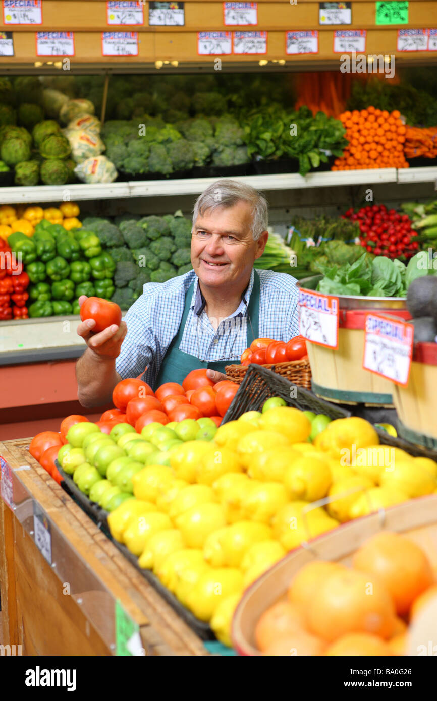 Produce manager of grocery store Stock Photo