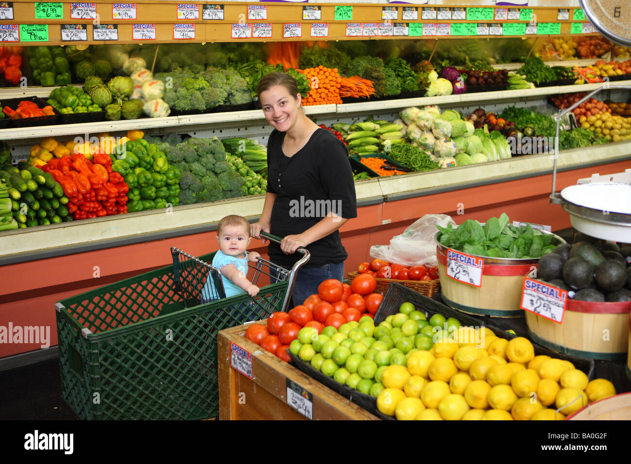 Mom and baby in grocery store Stock Photo